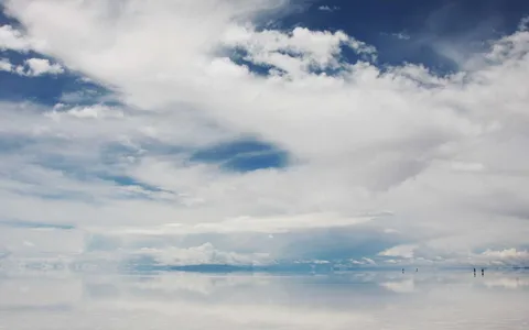 Clouds mirrored on a flooded salt flat